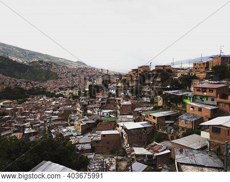 Panorama Cityscape Of Colorful Brick Houses In Comuna 13 San Javier Neighborhood Poverty Slum In Med