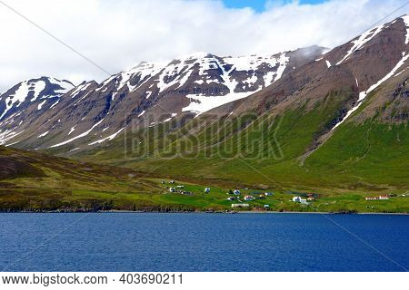 Spectacular View Of The Partially Covered Snowy Mountain Along The Fjord Near Olafsfjordur, Iceland
