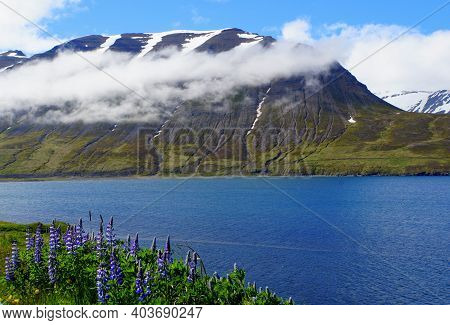 Spectacular View Of The Partially Covered Snowy Mountain Along The Fjord Near Olafsfjordur, Iceland