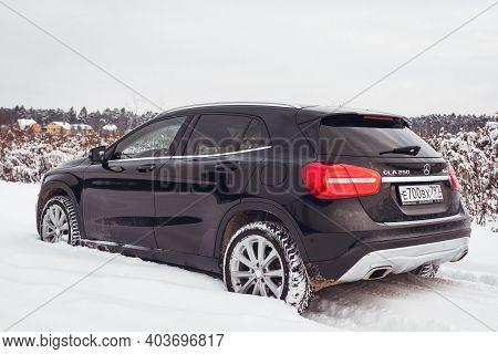 Moscow, Russia-january 10, 2021: A Black Mercedes Benz Gla 250 Luxury Crossover Makes Its Way Throug