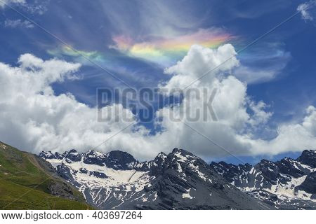 Iridescent Cloud Over The Road To Stelvio Pass, Sondrio Province, Lombardy, Italy, At Summer.