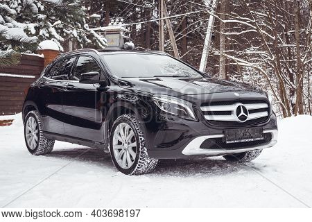 MOSCOW, RUSSIA-JANUARY 10, 2021: Mercedes Benz GLA 250 on a snow-covered street outside the city.