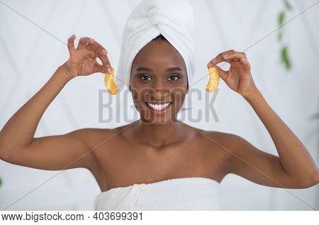 Modern Cosmetology And Anti-fatigue Patches Under Eyes At Home. Cheerful Young African American Woma