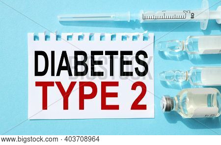 Diabetes Type 2.text On White Paper On A Blue Background Near The Ampoules And Syringe