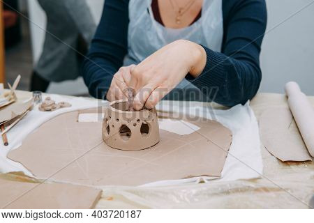 Womens Hands Knead Clay, Drawing Elements Of The Product. Production Of Ceramic Products At The Mast