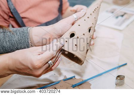 Women's Hands Knead Clay, Drawing Elements Of The Product. Production Of Ceramic Products At The Mas
