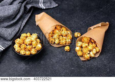 Salted Caramel Popcorn In Bowl On Dark Background