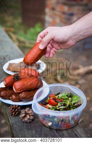 Sausages, Bread And Salad - Food To Prepaire On A Fire. Concept Of Outdoor Cooking.