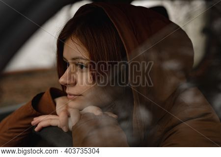 Young Girl Behind The Car Window Thinking About Life Captured From The Side