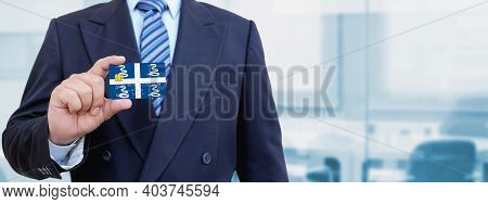 Cropped Image Of Businessman Holding Plastic Credit Card With Printed Flag Of Martinique. Background