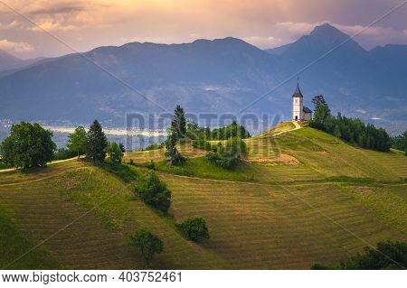 Mountain Scenery With Church On The Mountain Ridge. Colorful Sunset Scenery And Cute Saint Primoz Ch