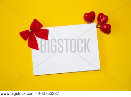 Valentines Day Congratulation. Red Rose And Greeting Card With Heart Sign On Black Background Top Vi