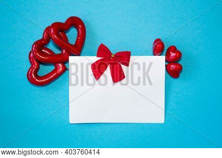 Valentines Day Congratulation. Red Rose And Greeting Card With Heart Sign On Black Background Top Vi