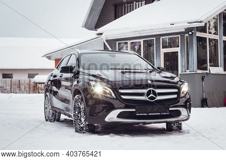MOSCOW, RUSSIA-JANUARY 10, 2021: Black luxury crossover Mercedes Benz GLA 250 on a suburban plot in
