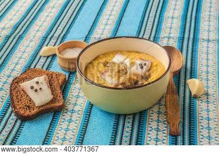 Corn Porridge - Banosh With Toasted Bacon, Onions, Rye Bread With Pepper And Bacon, Garlic And A Spo