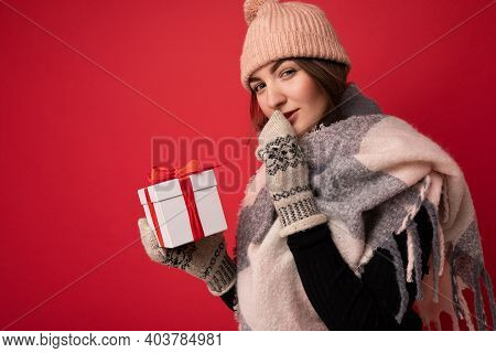 Shot Of Charming Sexy Positive Young Brunette Woman Isolated Over Red Background Wall Wearing Winter