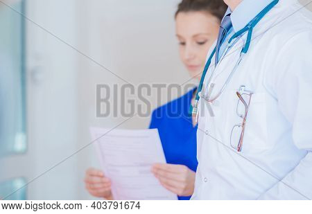 Healthcare Professionals Theme. Medical Personel Inside Hospital Hallway Close Up.