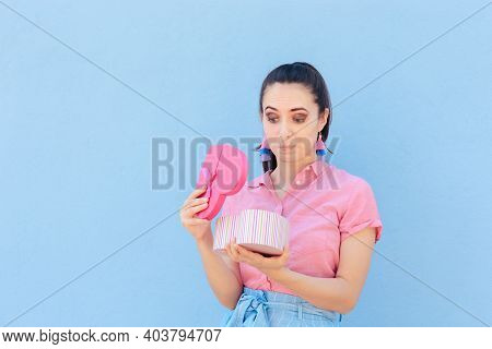 Unhappy Girlfriend Receiving A Bad Gift On Valentine\'s Day