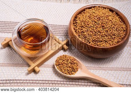 Healing Drink, Seeds, Medicinal Plant Fenugreek On A Wooden Light Table Closeup. Shambala Grains For