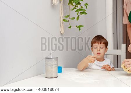 Little Boy Helps Mother To Cook  Making Homemade Coockies. Casual Lifestyle In Home Interior, Pretty