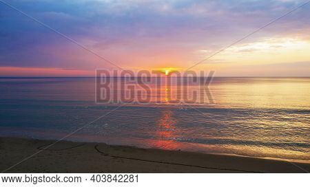Beautiful Sunset Over The Clam Sea With Cloud Sky Background. Sunset Over Tropical Beach. Nature Sum