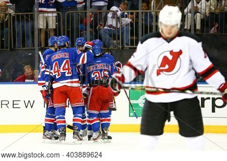 NEW YORK-APR 27: New York Rangers left wing Rick Nash (61) celebrates with teammates after scoring a goal against the New Jersey Devils at Madison Square Garden on April 27, 2013 in New York City.