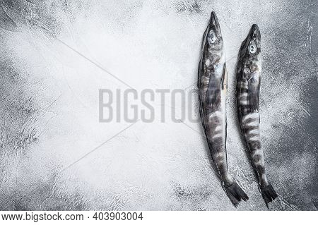 Raw Icefish On A Kitchen Table. White Background. Top View. Copy Space