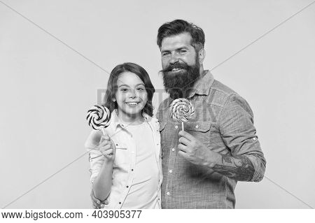 Dessert Makes Mouths Happy. Happy Family Hold Lollipops Yellow Background. Father And Daughter Enjoy