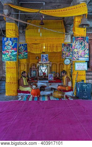 Hampi, Karnataka, India - November 5, 2013: Malyavanta Raghunatha Temple. 2 Priests Sit And Chant Co