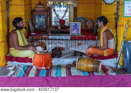 Hampi, Karnataka, India - November 5, 2013: Malyavanta Raghunatha Temple. Closeup Of 2 Priests Sit A