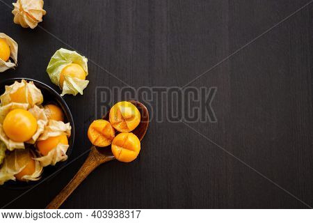 Cape Gooseberry Or Physalis Minima On Wood Background. Tropical Fruit And Food For Health Concept.
