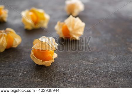 Cape Gooseberry Or Physalis Minima On Wood Background. Tropical Fruit And Food For Health Concept.
