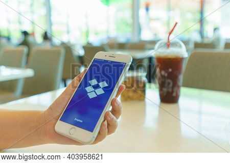 Chiang Mai, Thailand - Sep. 26,2020: Woman Holding Iphone With Dropbox On Screen. Dropbox Is A Servi