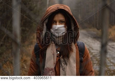 Young Girl Wears Mask That Protects Againts The Spread Of Coronavirus Covid-19
