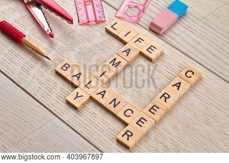 Career And Family Life Balance. Scissors With Ruler And Pencil On The Wooden Desk.