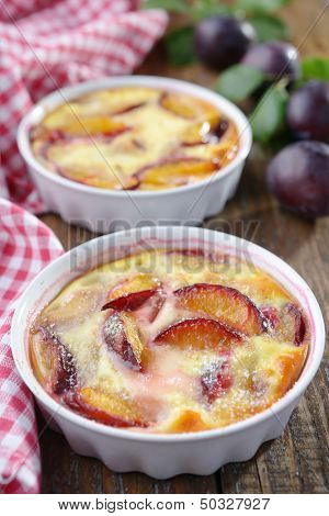 Plum clafoutis in a baking dish
