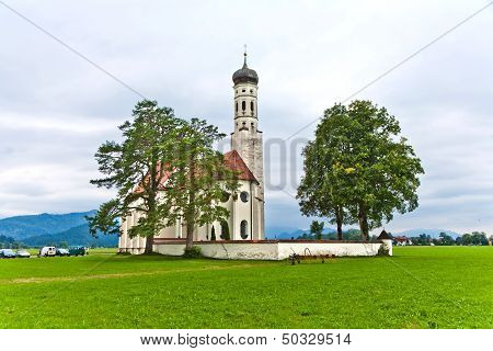 Typical Bavarian Or Austrian Landscape With A Chape