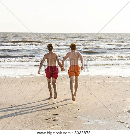 Teenager Enjoys Jogging Along The Beach