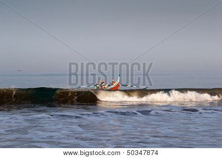 PADANG - AUGUST 25: A team of fishermen take the boat out to sea to lay the fishing nets in Padang, West Sumatera, Indonesia on August 25, 2013. Resources from the sea is a major revenue earner.  