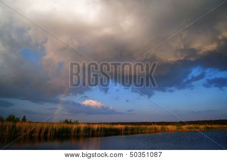 Storm cloud and a rainbow.