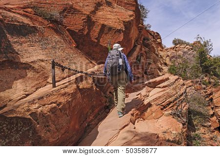 Hiker On A Chain Assisted Trail