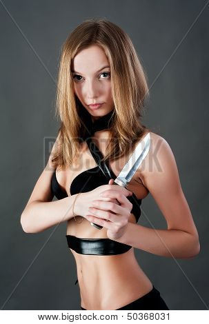 Pretty girl with knife