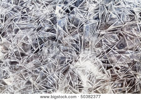Ice Crystals Over Frozen Puddle