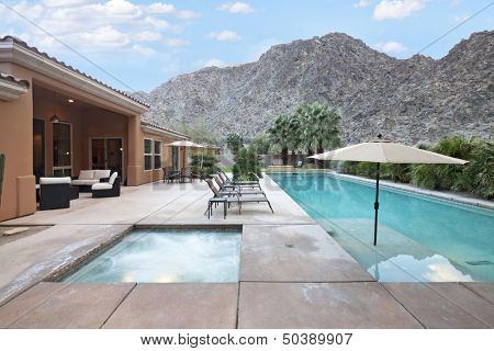 Rear view of luxury villa with swimming pool