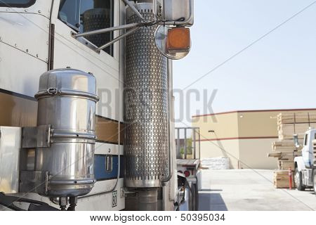 Close-up of flatbed truck in timber yard