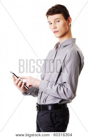 Young businessman using tablet computer isolated on white background