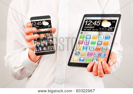 Smart phone (phablet) and tablet with a transparent display in human hands. Concept actual future innovative ideas and best technologies humanity.