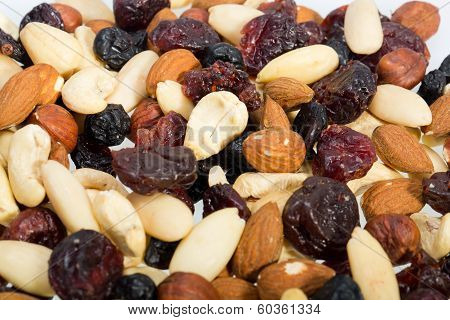 mixed nuts and dried fruits isolated on white background