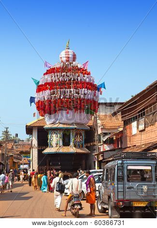 GOKARNA INDIA - JANUARY 31: The ancient wooden chariots with flags and paintings of hindu gods in th