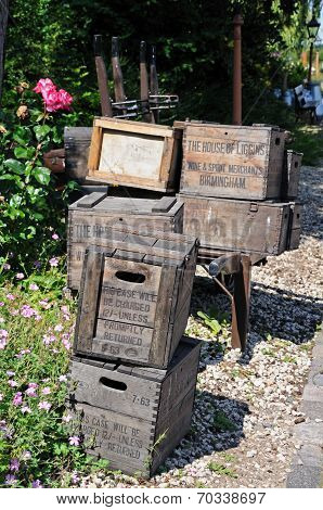 Old wooden crates on railway platform.